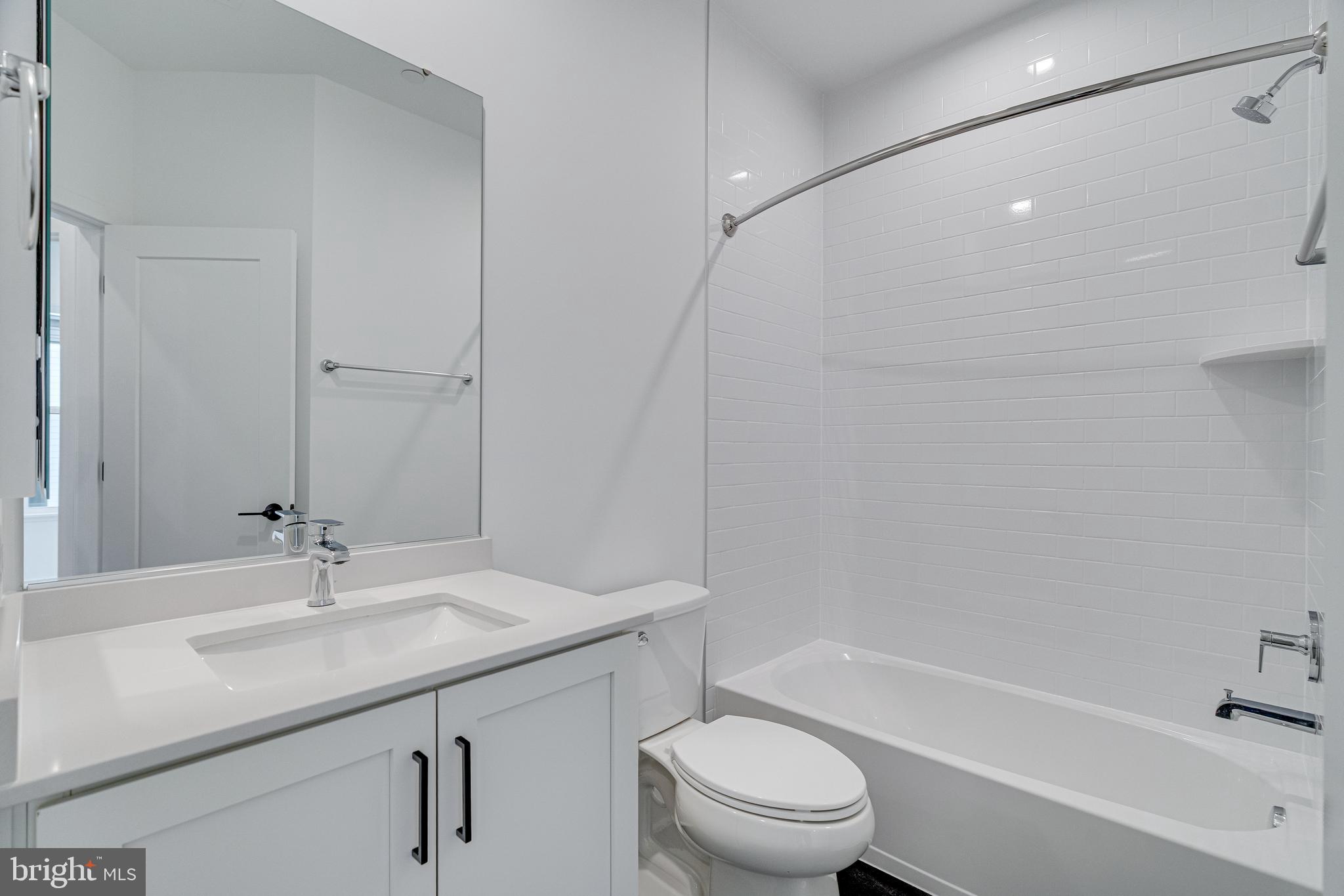 2070 Tysons Ridgeline Road Falls Church, VA 22043 - Photo 46 of 57 a bathroom with a sink a toilet and shower