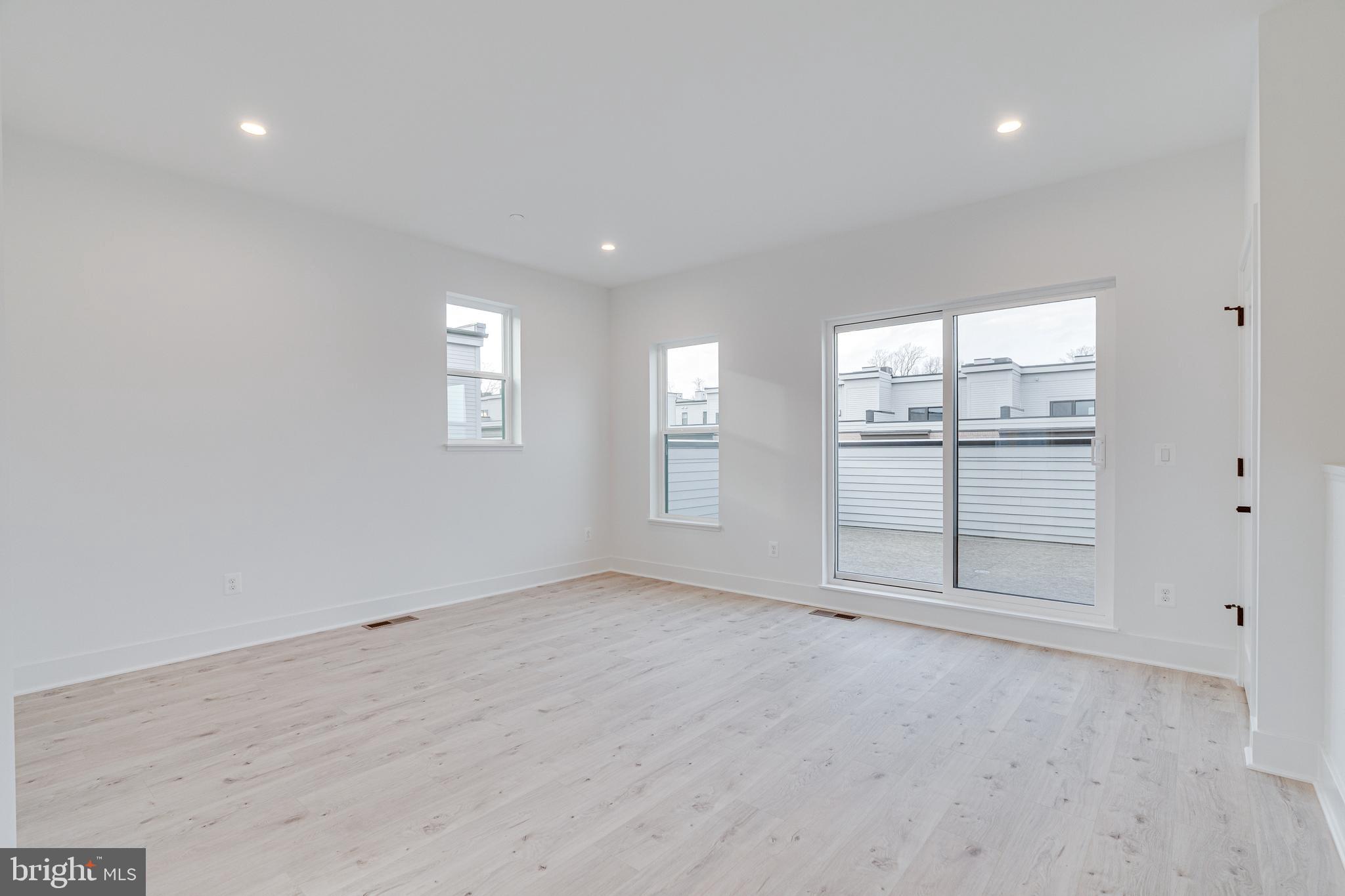 2070 Tysons Ridgeline Road Falls Church, VA 22043 - Photo 47 of 57 an empty room with windows and pillars in it