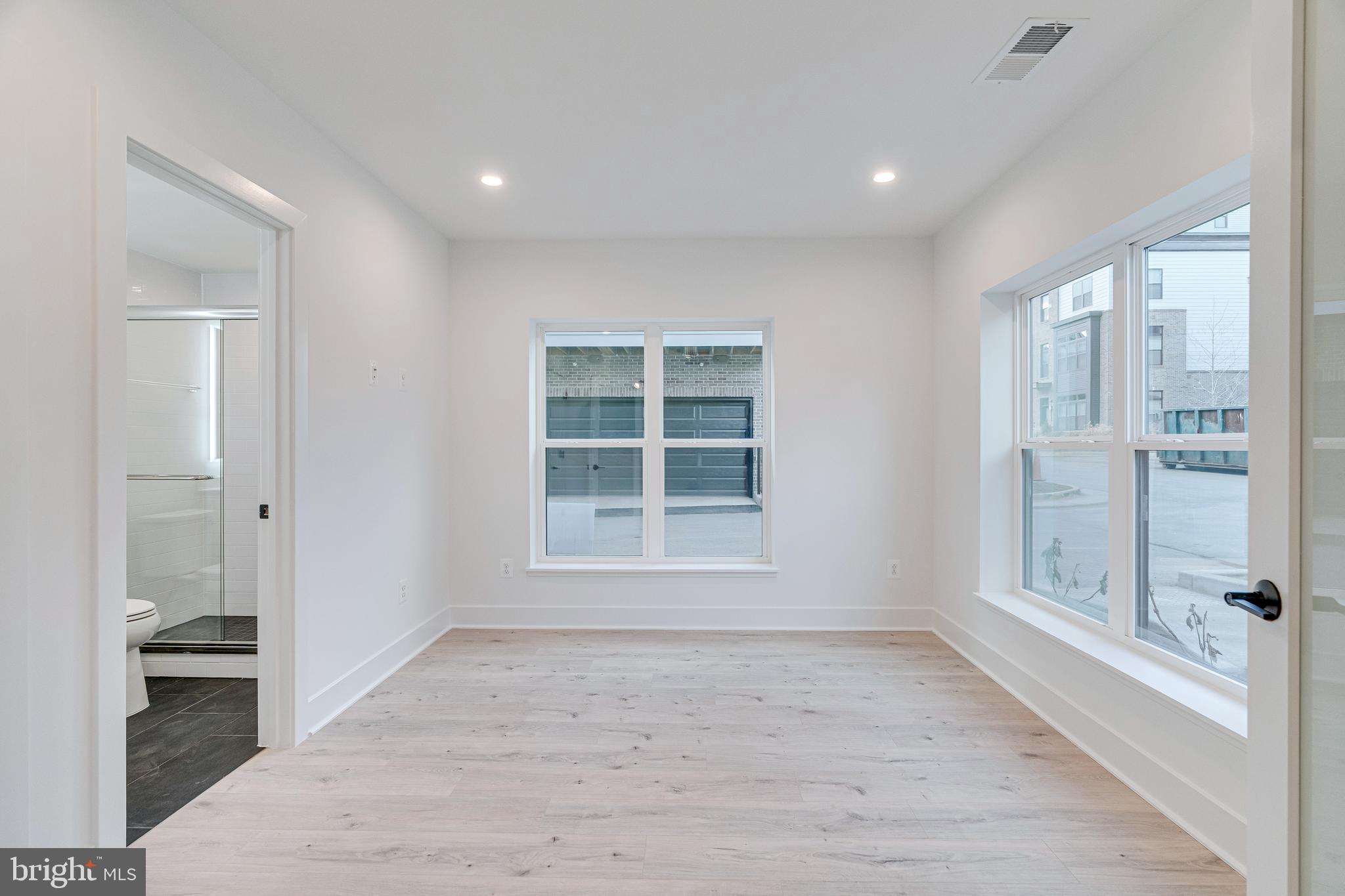 2070 Tysons Ridgeline Road Falls Church, VA 22043 - Photo 9 of 57 a view of empty room with wooden floor and fan