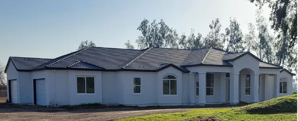 a house view with a garden space