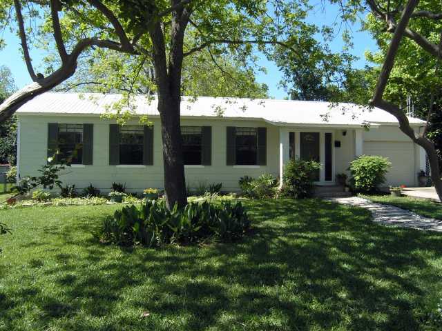 1801 Alguno Road Austin, TX 78757 - Photo 1 of 1 a view of a house with a yard