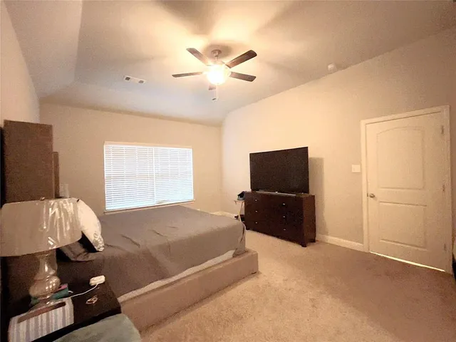 a large room with a table and chairs