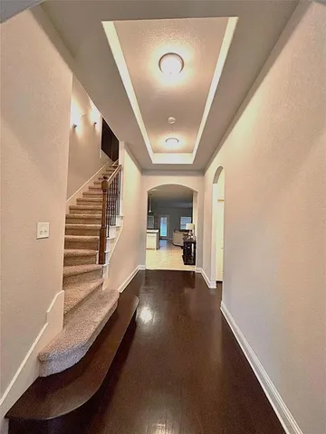 a view of a hallway with staircase