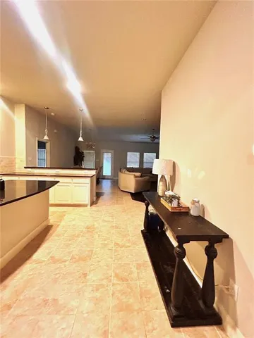 a lobby with furniture and a kitchen