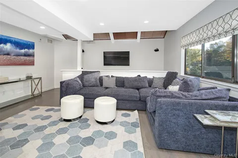 a bathroom with a sink mirror and toilet