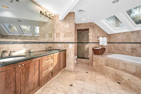 a bedroom with a large bed and a dresser