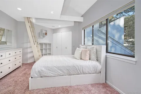 a bathroom with a granite countertop sink mirror vanity and toilet