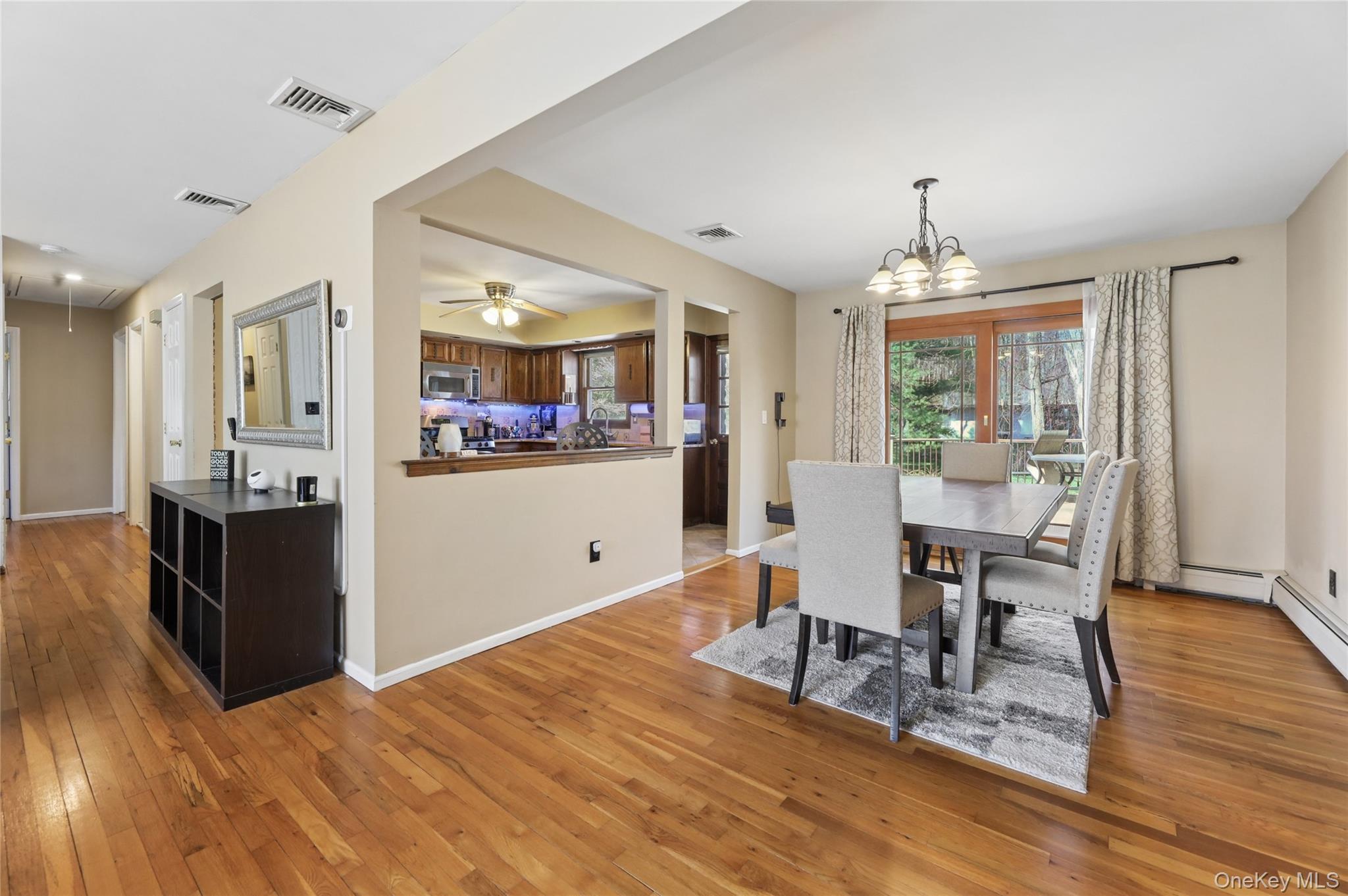 635 South Pascack Road Chestnut Ridge, NY 10977 - Photo 3 of 40 View from living room toward dining room with sliders to expansive deck