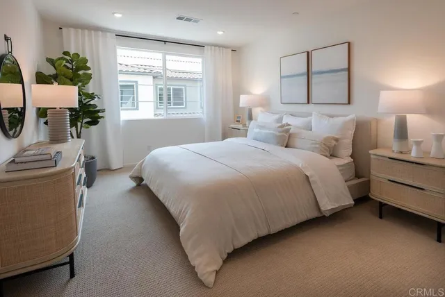 a bedroom with bed and window