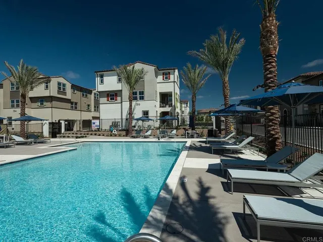 a view of a swimming pool with chairs