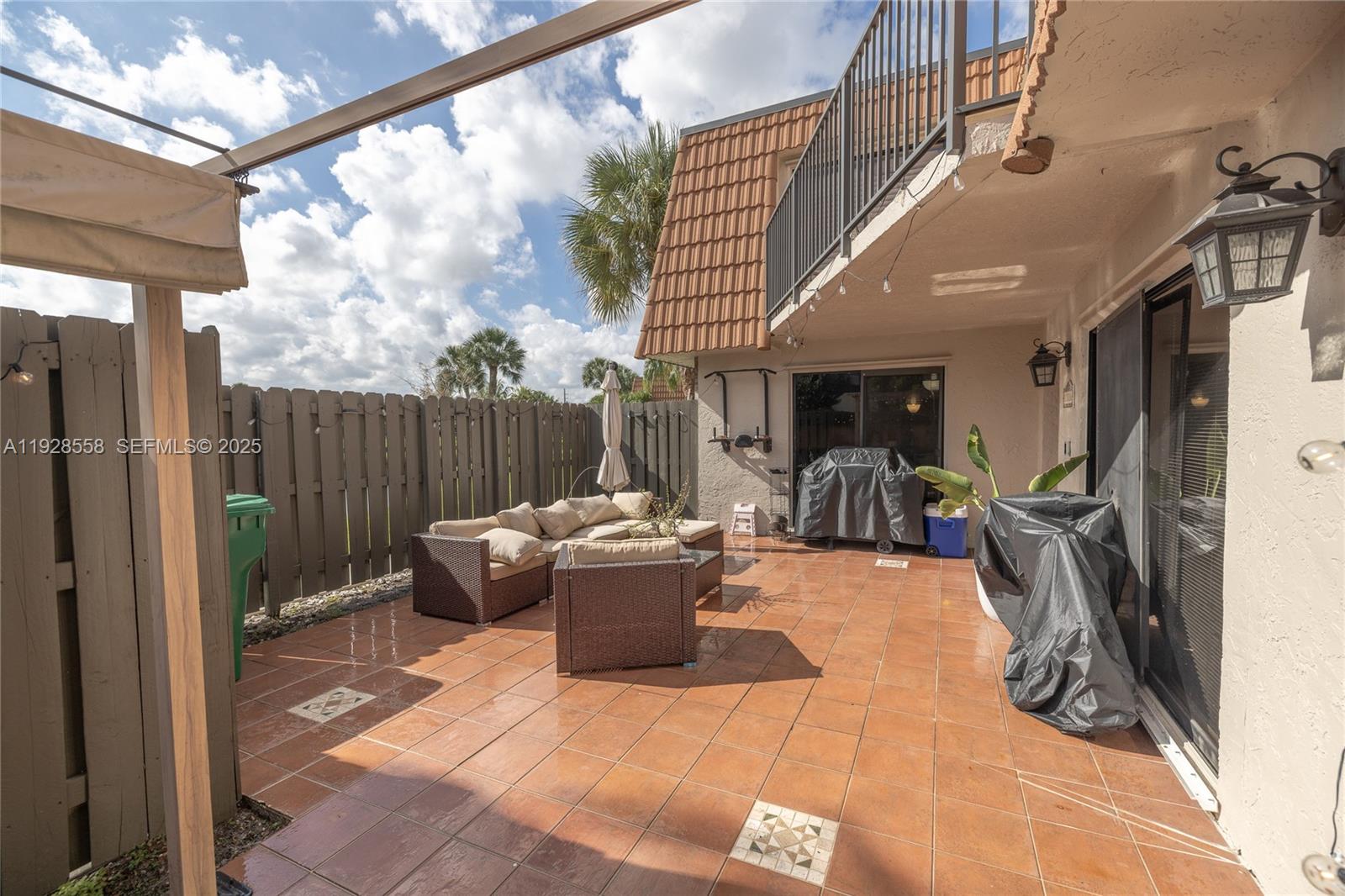 11006 North Harmony Lake Circle Davie, FL 33324 - Photo 13 of 46 a view of a patio with couches table and chairs