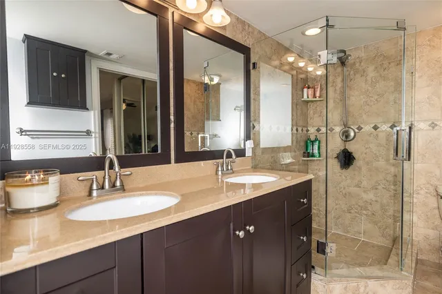 a bathroom with a sink double vanity and shower