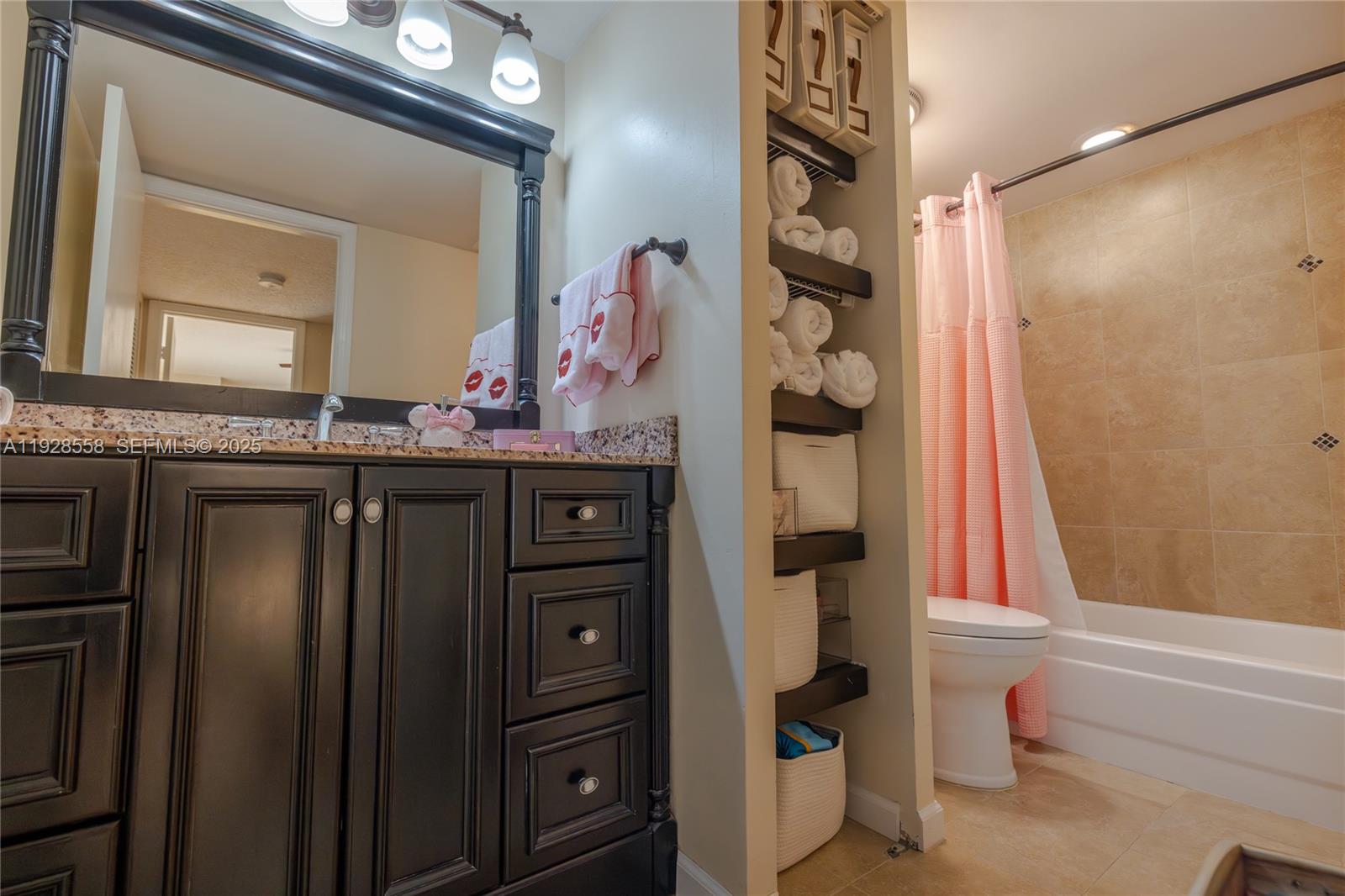 11006 North Harmony Lake Circle Davie, FL 33324 - Photo 20 of 46 a bathroom with a bathtub and a sink