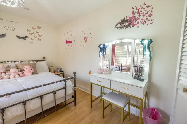 a bedroom with a bed and a table in it