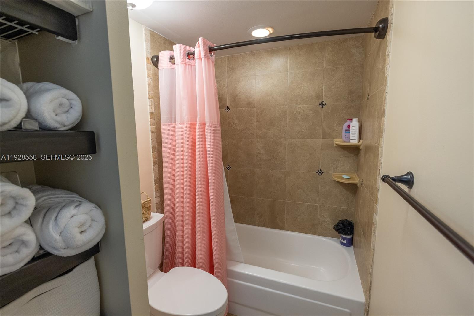 11006 North Harmony Lake Circle Davie, FL 33324 - Photo 25 of 46 a bathroom with a sink toilet and shower