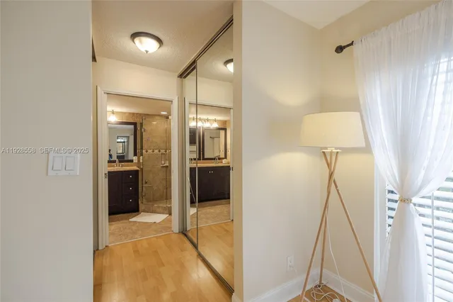 a bathroom with a shower and a sink