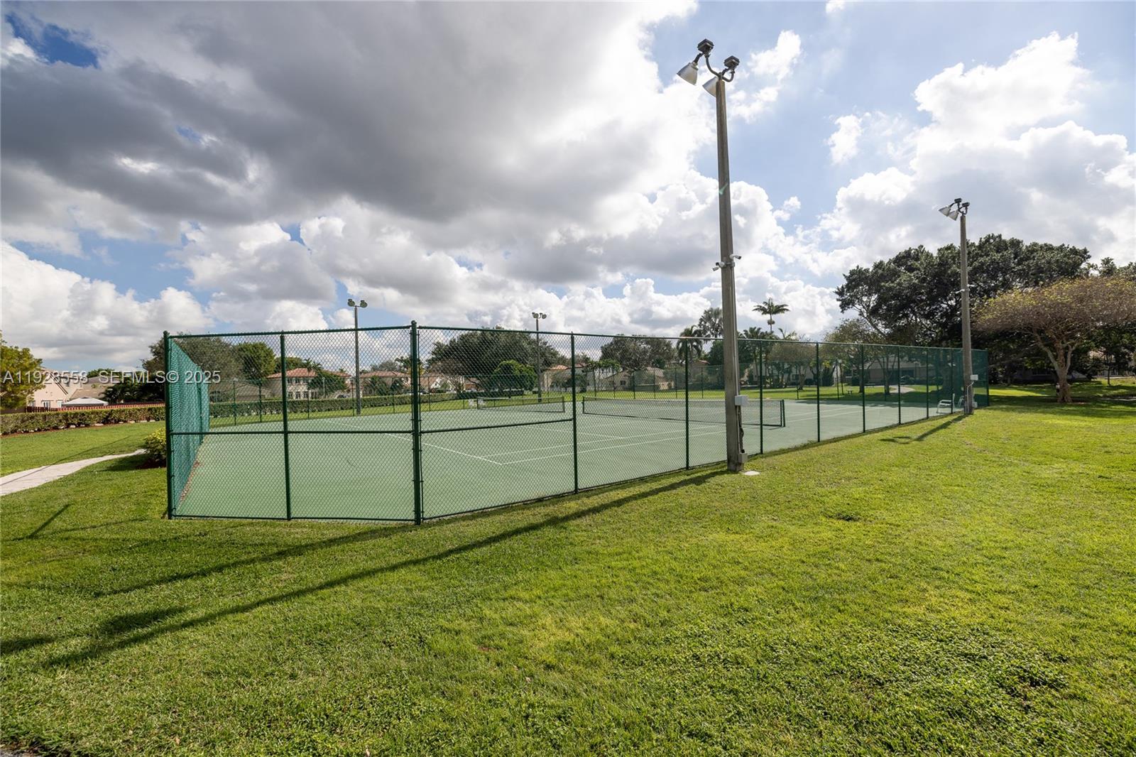 11006 North Harmony Lake Circle Davie, FL 33324 - Photo 36 of 46 a view of a green filed