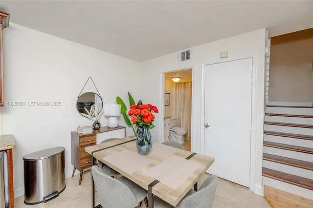 a view of a workspace with furniture