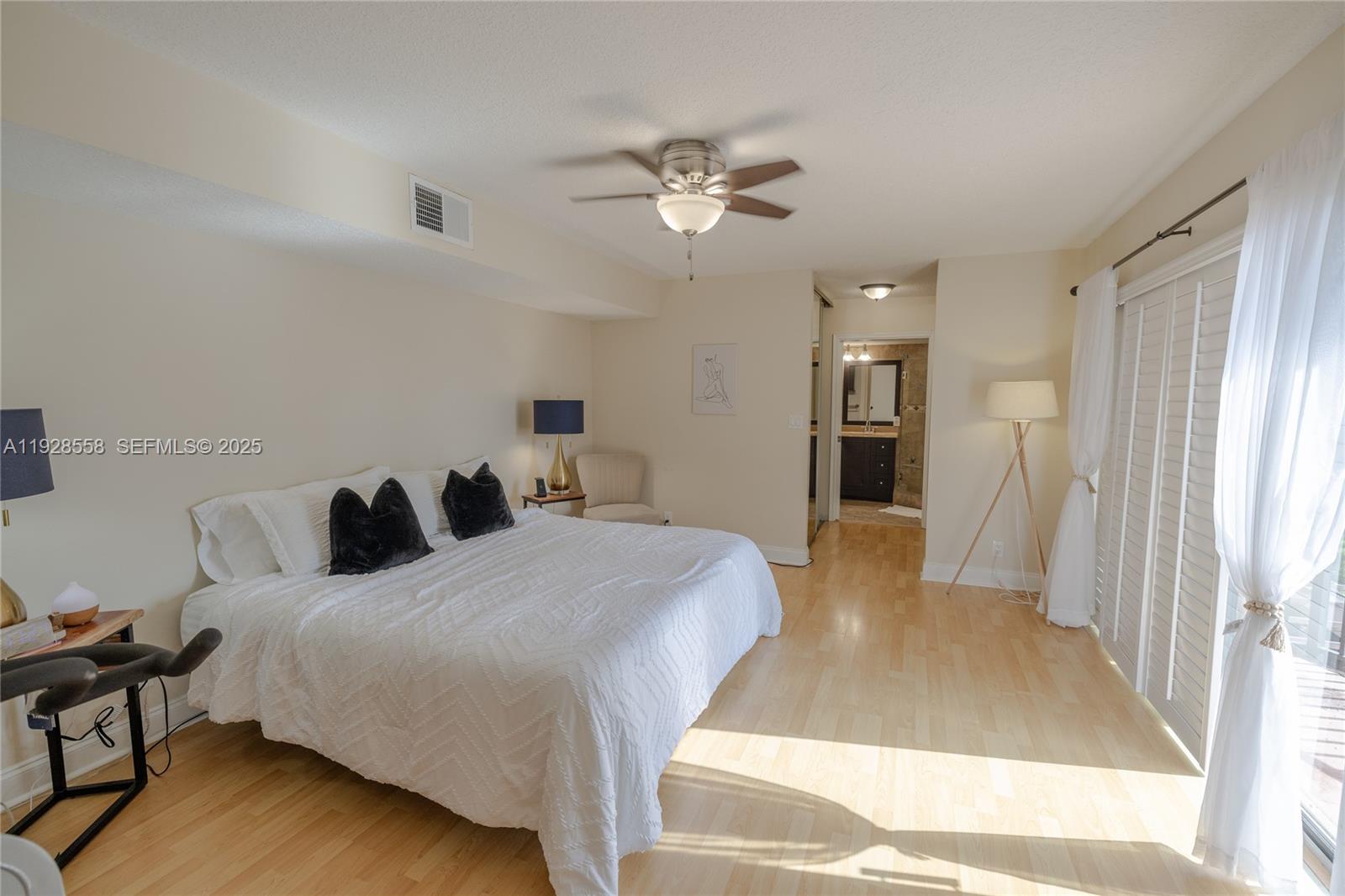 11006 North Harmony Lake Circle Davie, FL 33324 - Photo 10 of 46 a bed room with a bed and a window