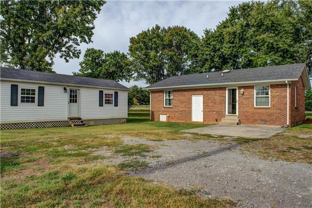4136 Florence Road Murfreesboro, TN 37129 - Photo 3 of 10 Back view of home with patio,14x32 storage shed has been prewired.