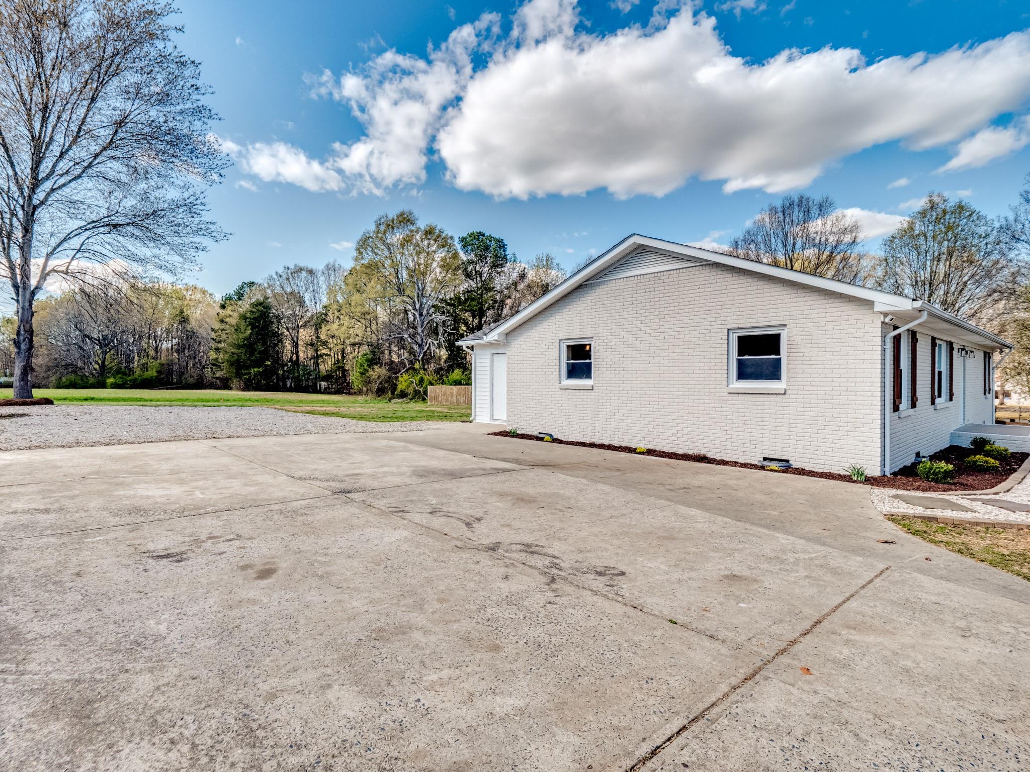 1813 Timber Ln Drive Monroe, NC 28110 - Photo 13 of 35 a view of a house with backyard and trees