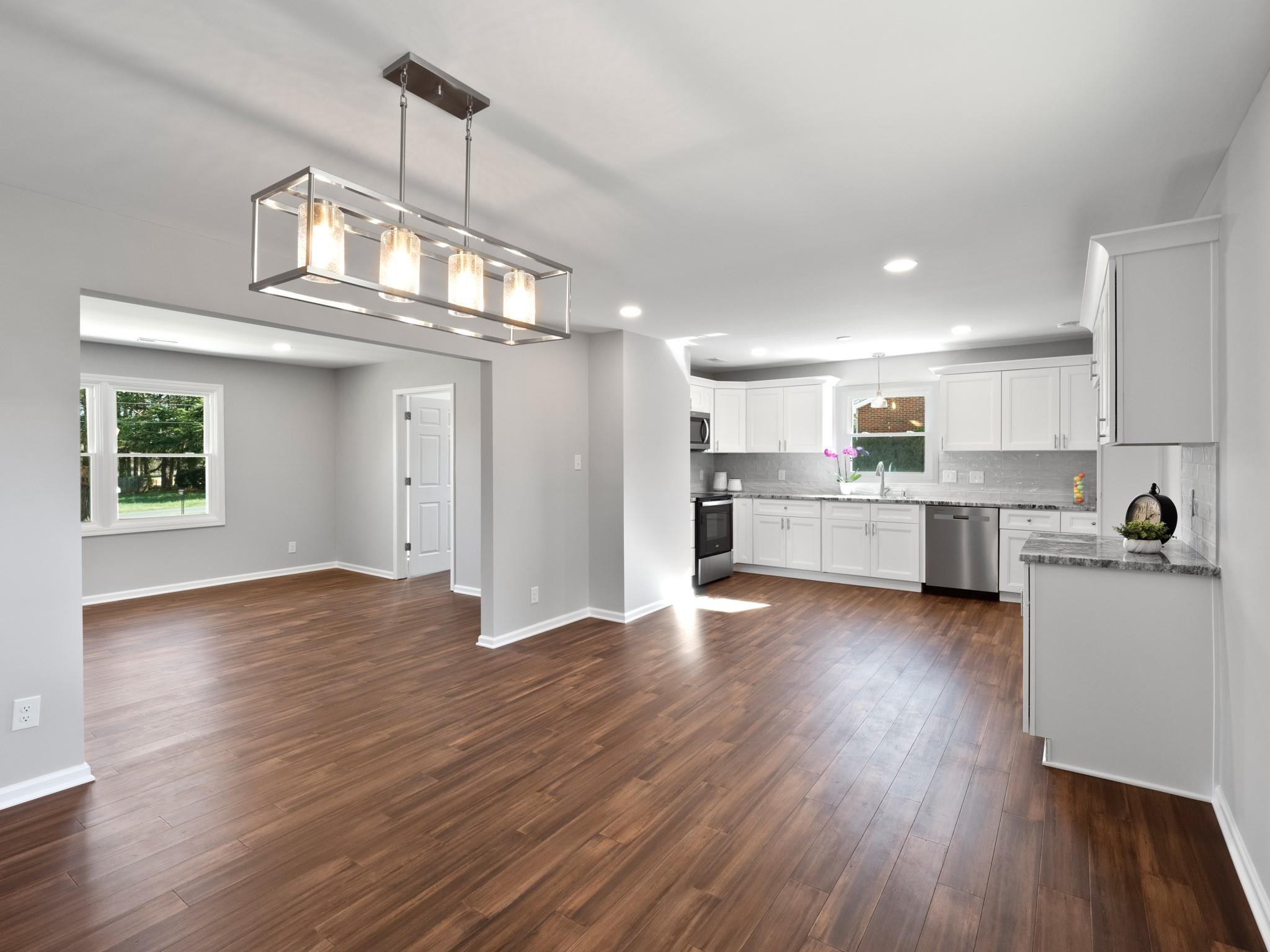 1813 Timber Ln Drive Monroe, NC 28110 - Photo 16 of 35 a view of a kitchen with a sink stainless steel appliances and cabinets