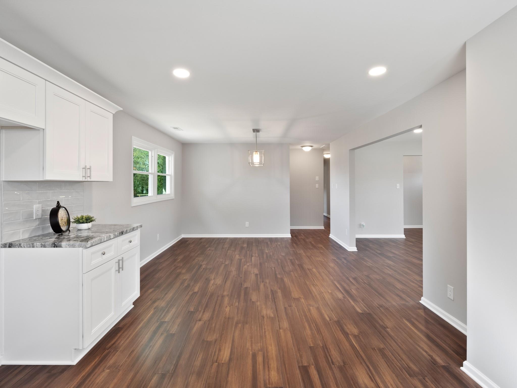 1813 Timber Ln Drive Monroe, NC 28110 - Photo 17 of 35 a kitchen with a sink and wooden floor