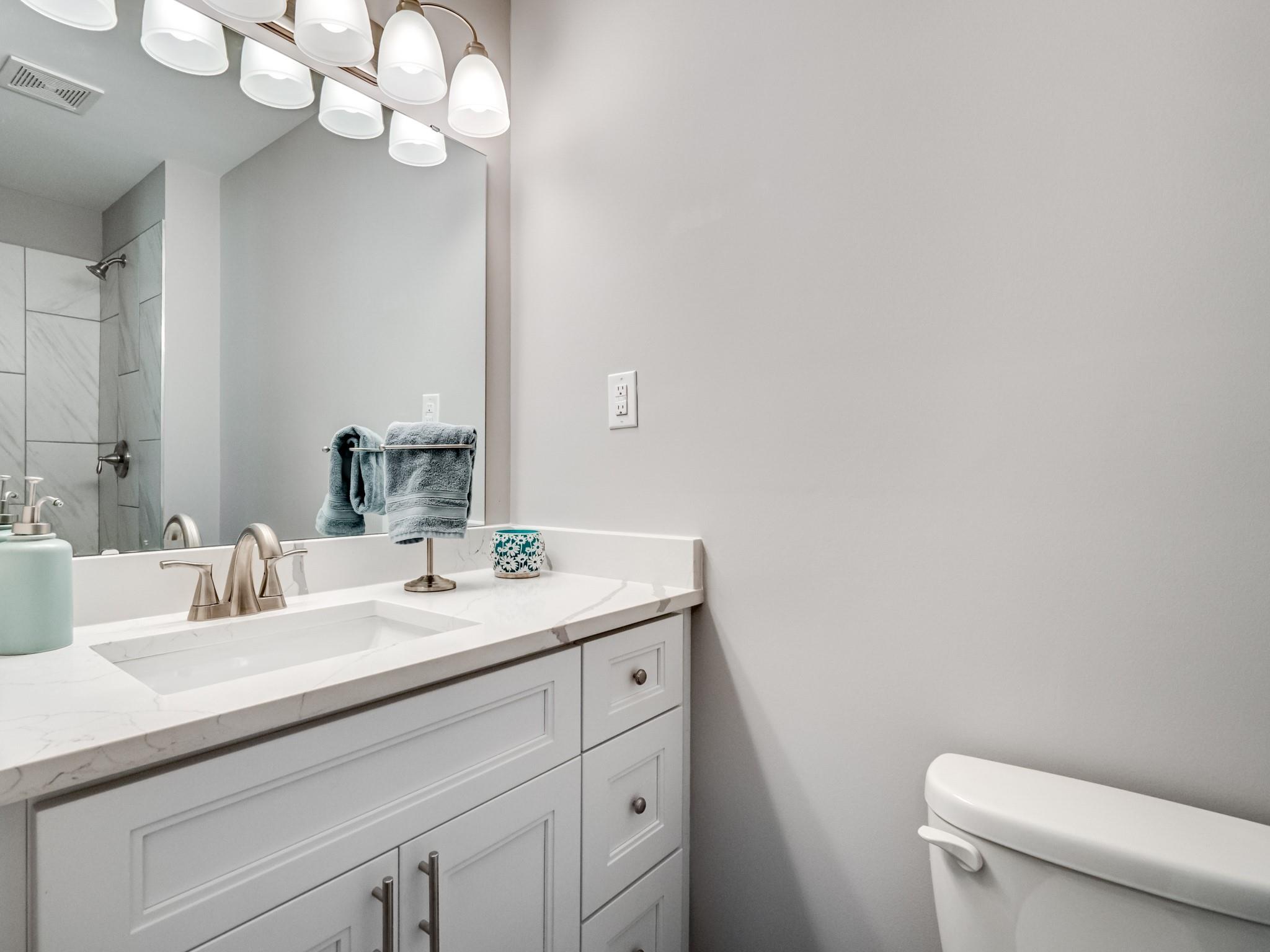 1813 Timber Ln Drive Monroe, NC 28110 - Photo 25 of 35 a bathroom with a sink a toilet and a mirror