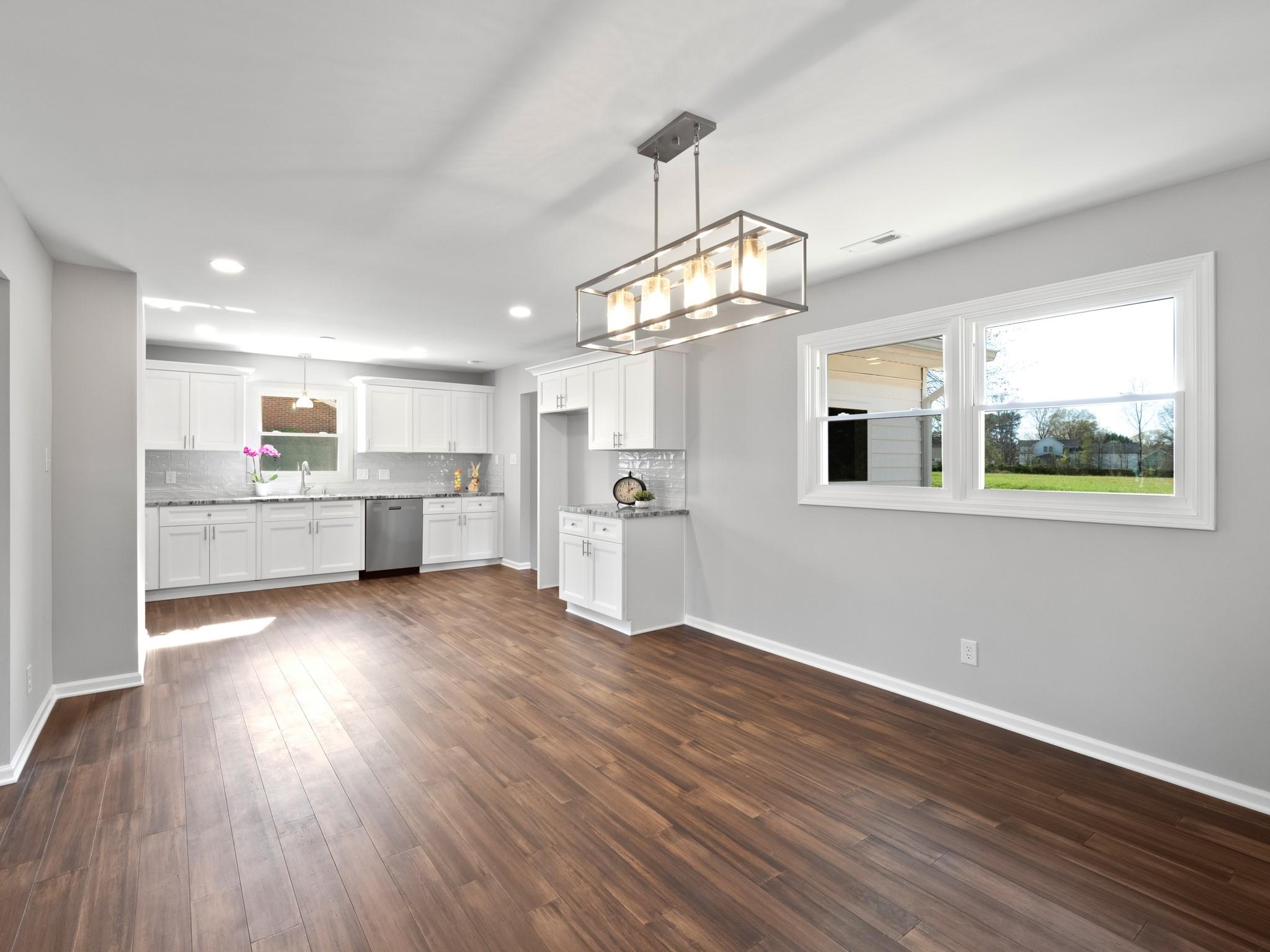 1813 Timber Ln Drive Monroe, NC 28110 - Photo 28 of 35 a view of a kitchen with a dishwasher cabinets and wooden floor