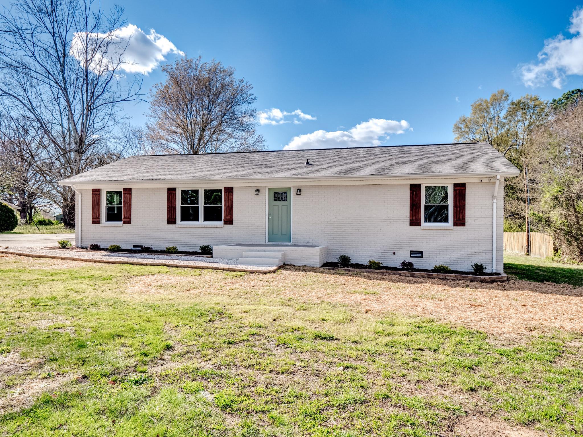 1813 Timber Ln Drive Monroe, NC 28110 - Photo 3 of 35 a view of a house with backyard and tree