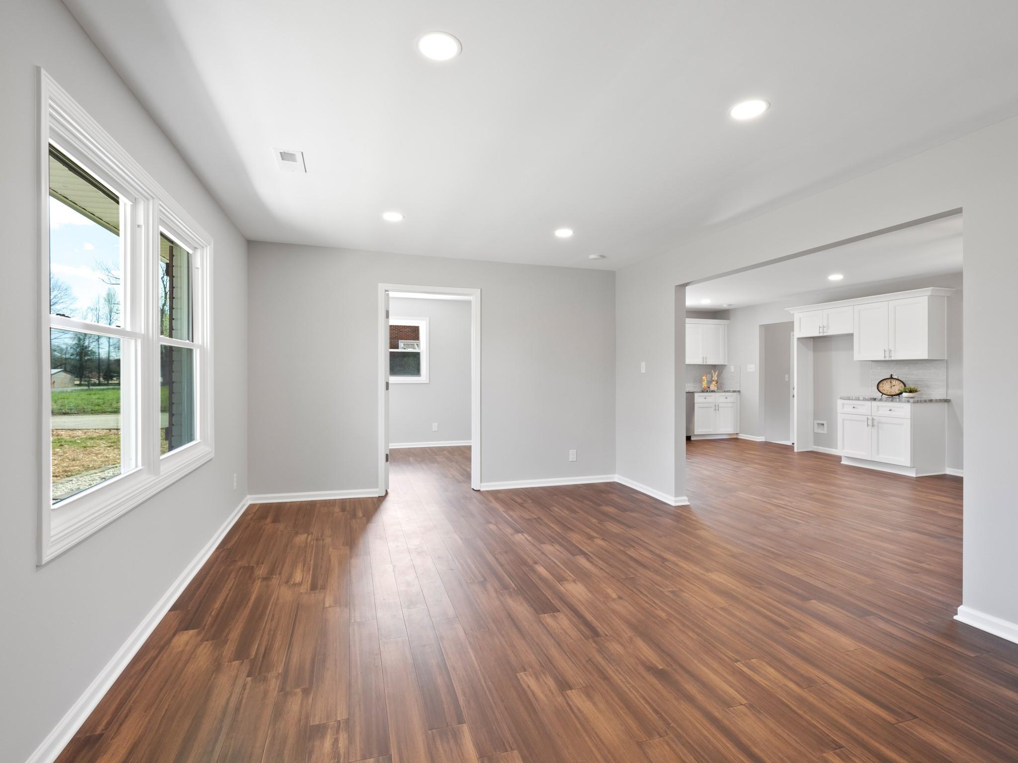 1813 Timber Ln Drive Monroe, NC 28110 - Photo 31 of 35 a view of empty room with wooden floor and fan