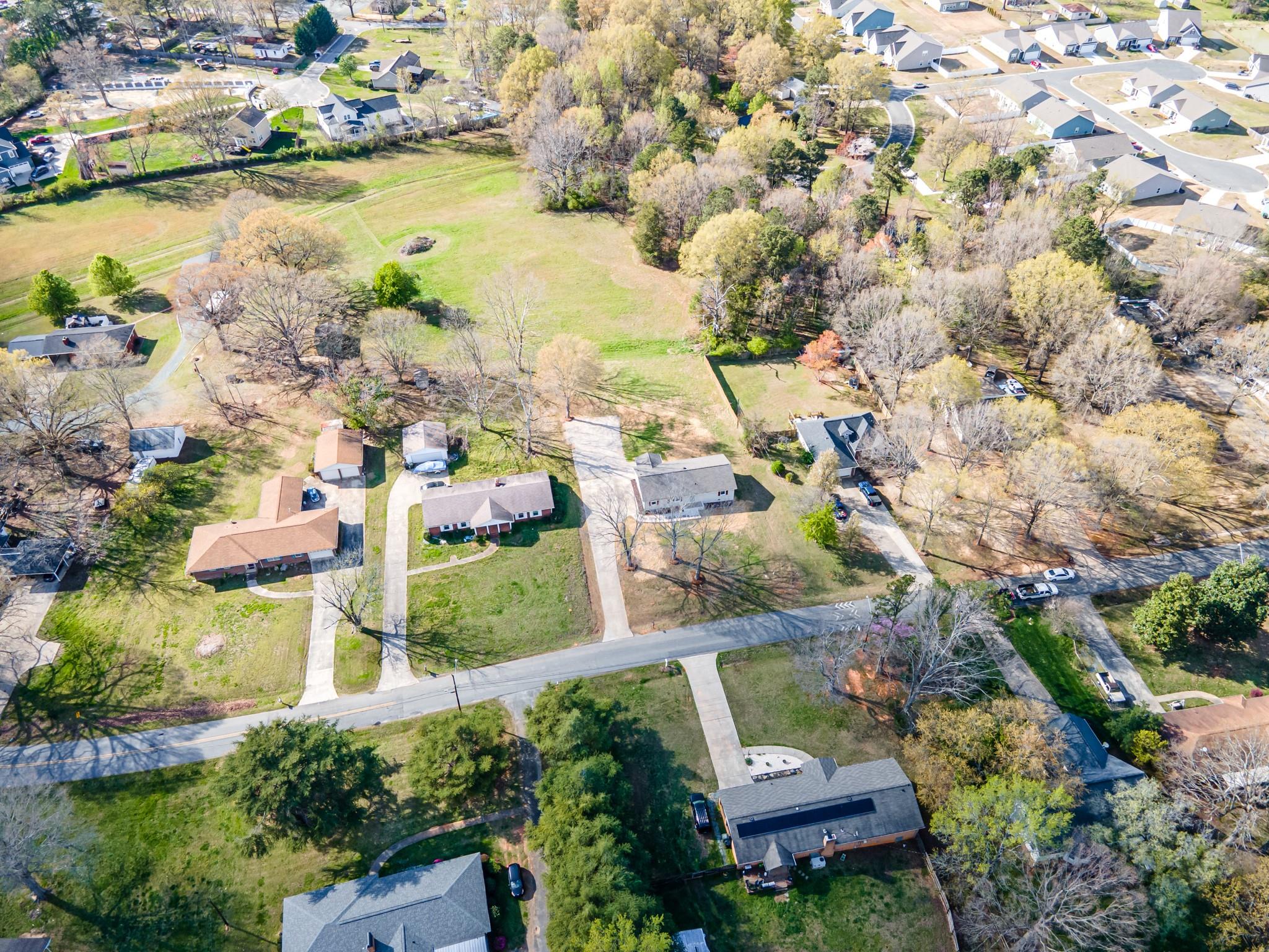1813 Timber Ln Drive Monroe, NC 28110 - Photo 34 of 35 an aerial view of residential houses with outdoor space and lake view
