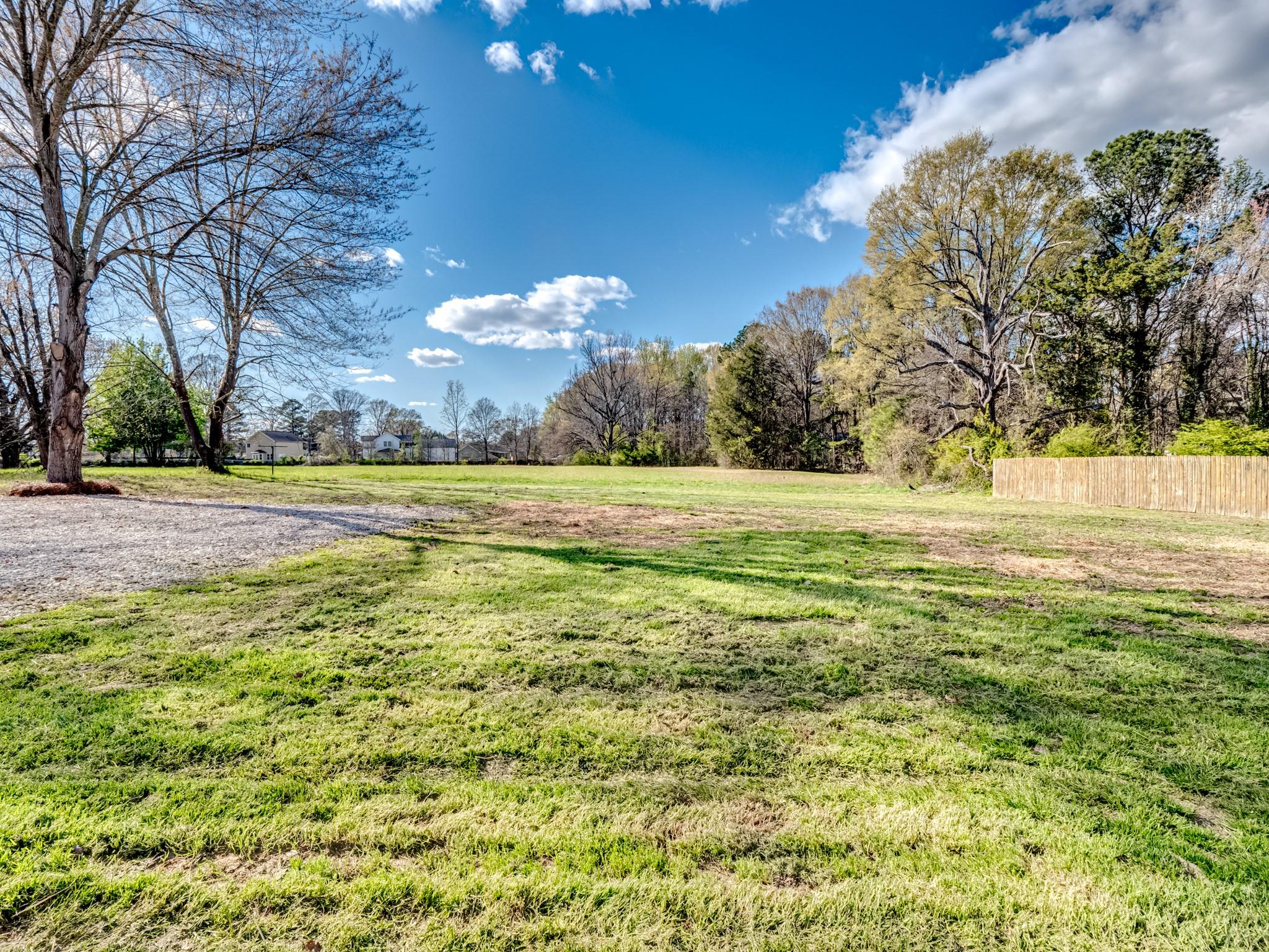 1813 Timber Ln Drive Monroe, NC 28110 - Photo 9 of 35 a view of a big yard with an trees