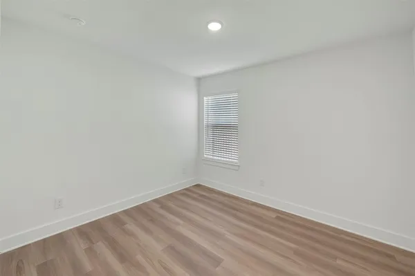 a view of a livingroom with wooden floor