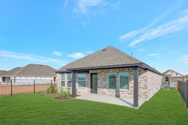 a front view of a house with a yard and porch