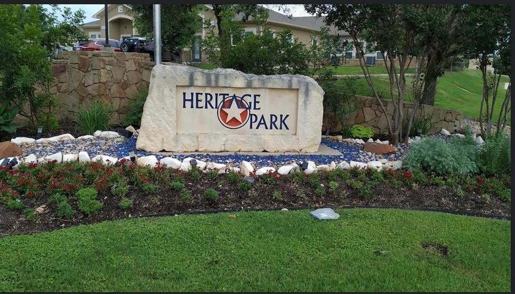 2409 Romeo Drive Cedar Park, TX 78613 - Photo 20 of 22 a sign of golf club on a wall under a tree