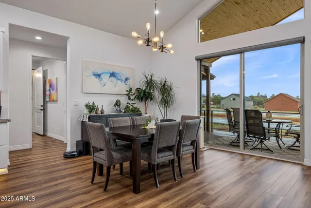 a large kitchen with a table and chairs