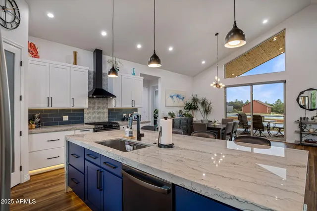 a bathroom with a double vanity sink and a large mirror