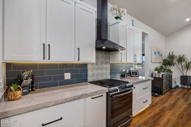 a bedroom with a bed and a chair