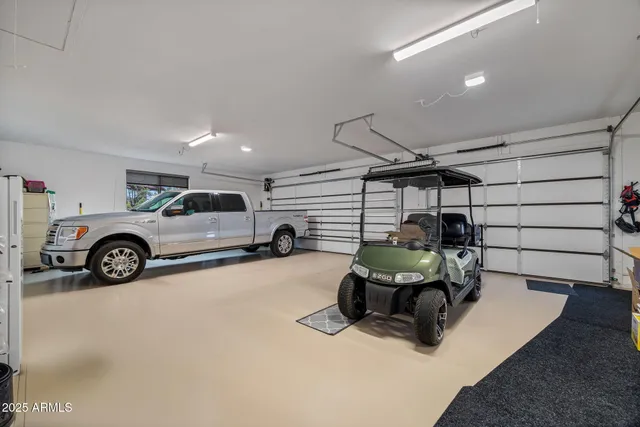 a house with yard and trees in the background