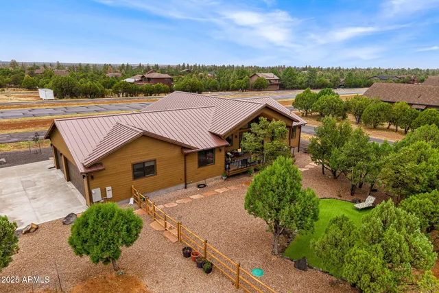 an aerial view of a house with a garden