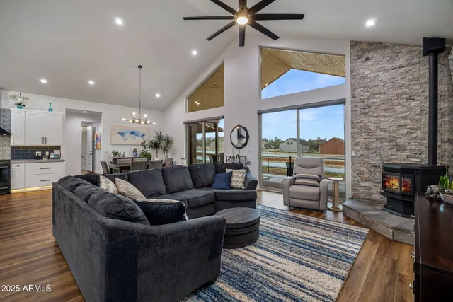 a living room with furniture flat screen tv and a fireplace