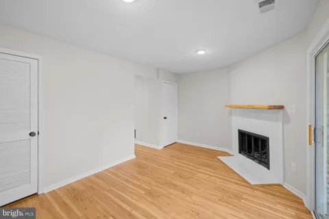 a bedroom with a bed and a fireplace