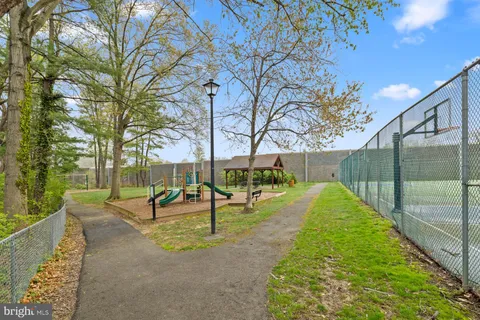 a view of a park with swings and slides
