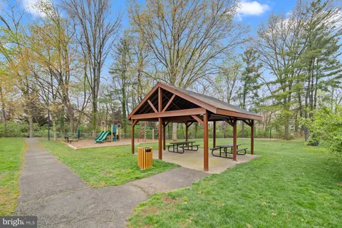 a view of house with yard and entertaining space
