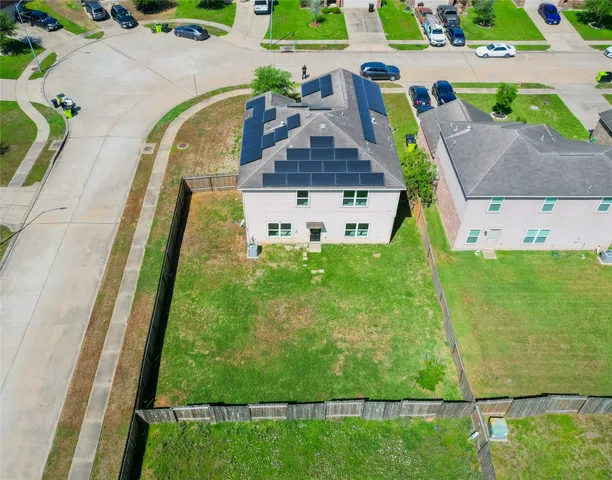 an aerial view of a house with a garden