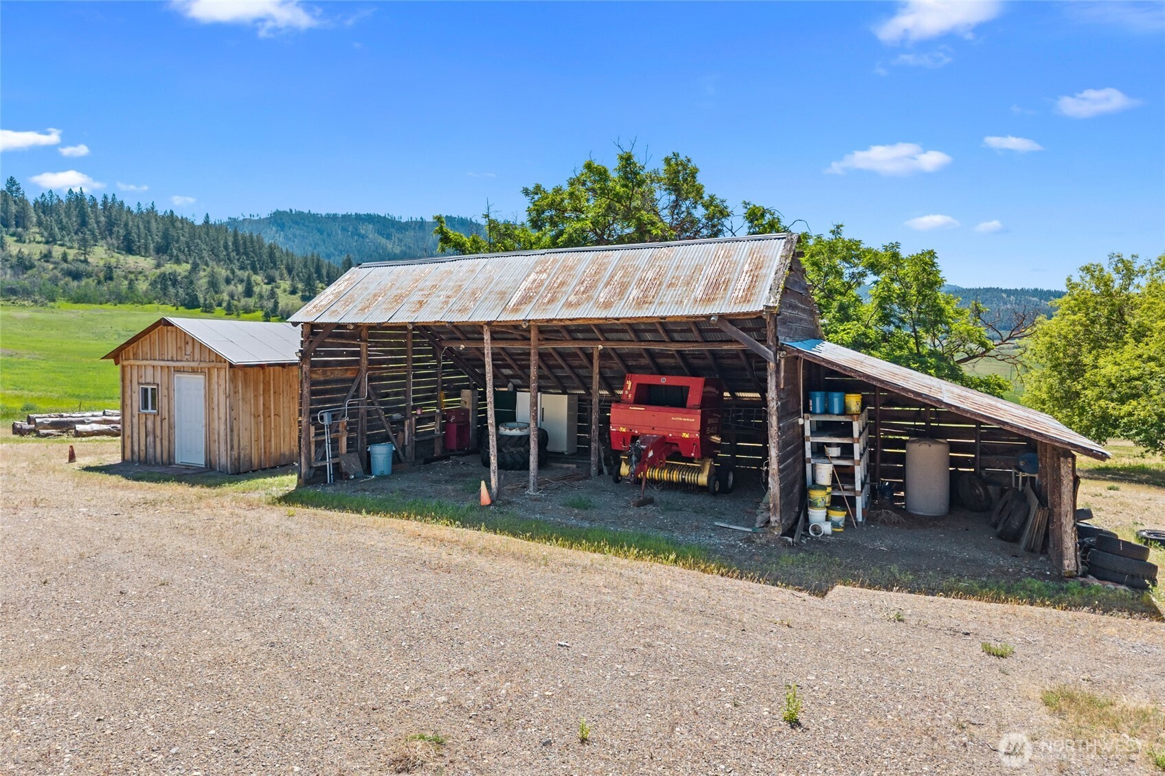 5793 Fruitland Valley Road Fruitland, WA 99129 - Photo 22 of 34 a view of a house with a backyard and a car