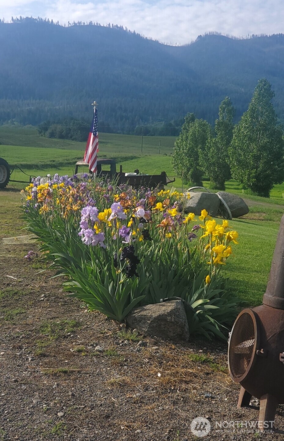 5793 Fruitland Valley Road Fruitland, WA 99129 - Photo 27 of 34 a view of a garden with a building in the background