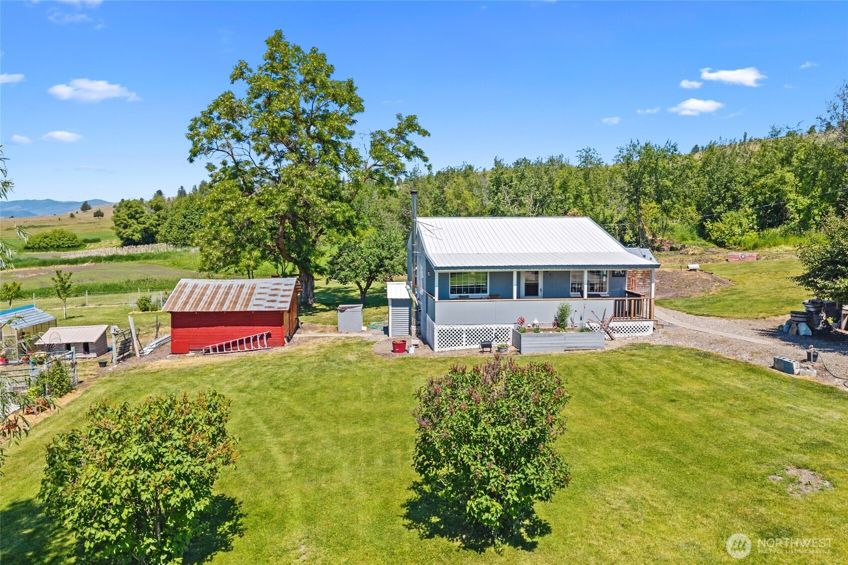 5793 Fruitland Valley Road Fruitland, WA 99129 - Photo 6 of 34 a house with swimming pool in front of it