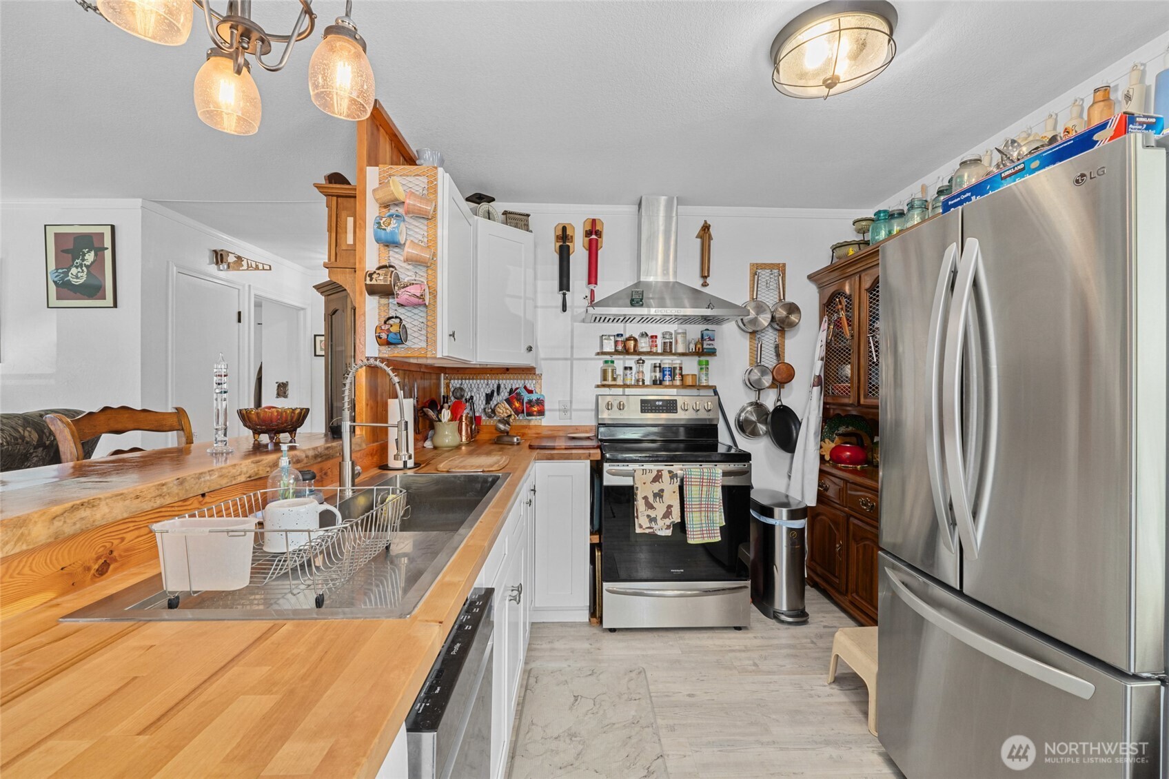 5793 Fruitland Valley Road Fruitland, WA 99129 - Photo 8 of 34 a kitchen with refrigerator and cabinets